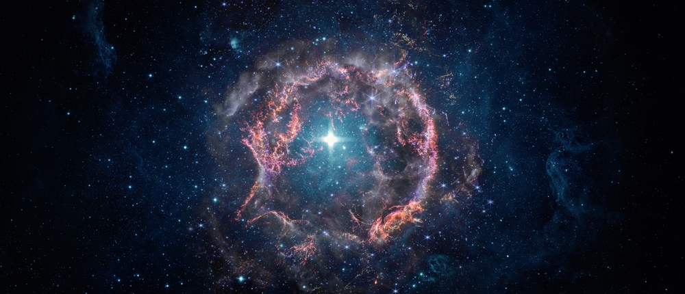 Photograph of a nebula surrounded by stars.